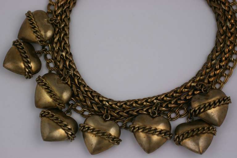 Oversized chunky brass wheat chain necklace with heart charms wrapped in chains by Butler and Wilson, UK. 1980;s UK. 16