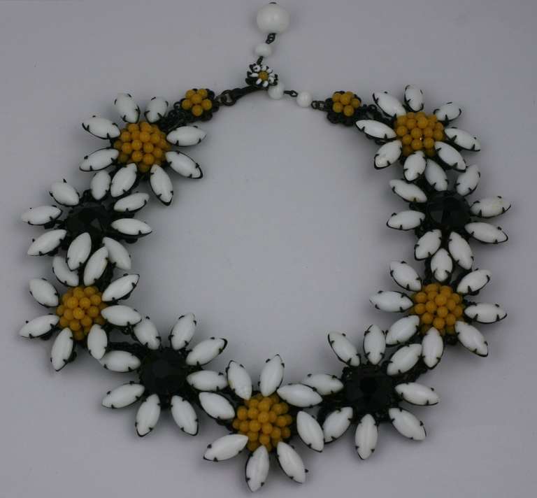 Miriam Haskell flower necklace of milk glass  marquise shaped petals,with
marigold pave and black jet beaded   flowercenters, the necklace settings of japanned blackened metal. 1940's USA. Excellent condition. Unworn
Length 13.75