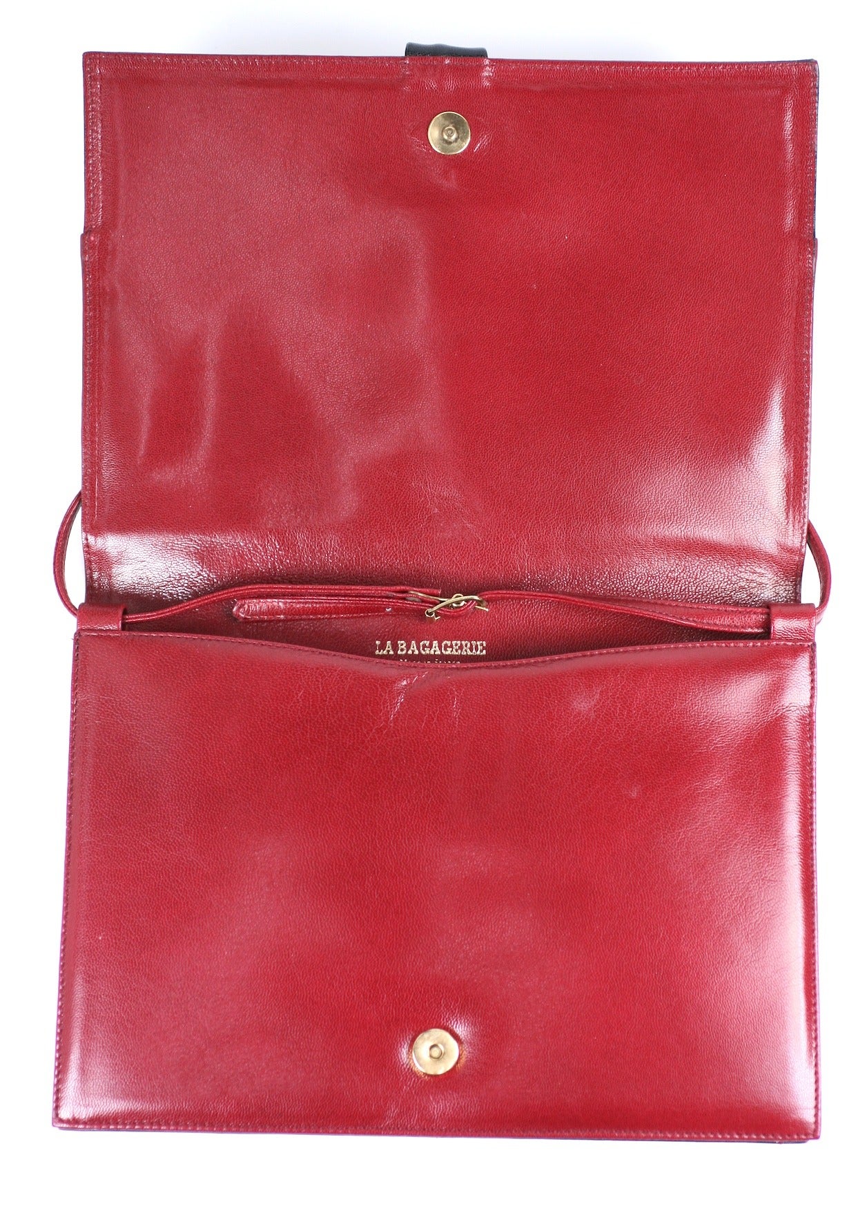navy and red clutch bag