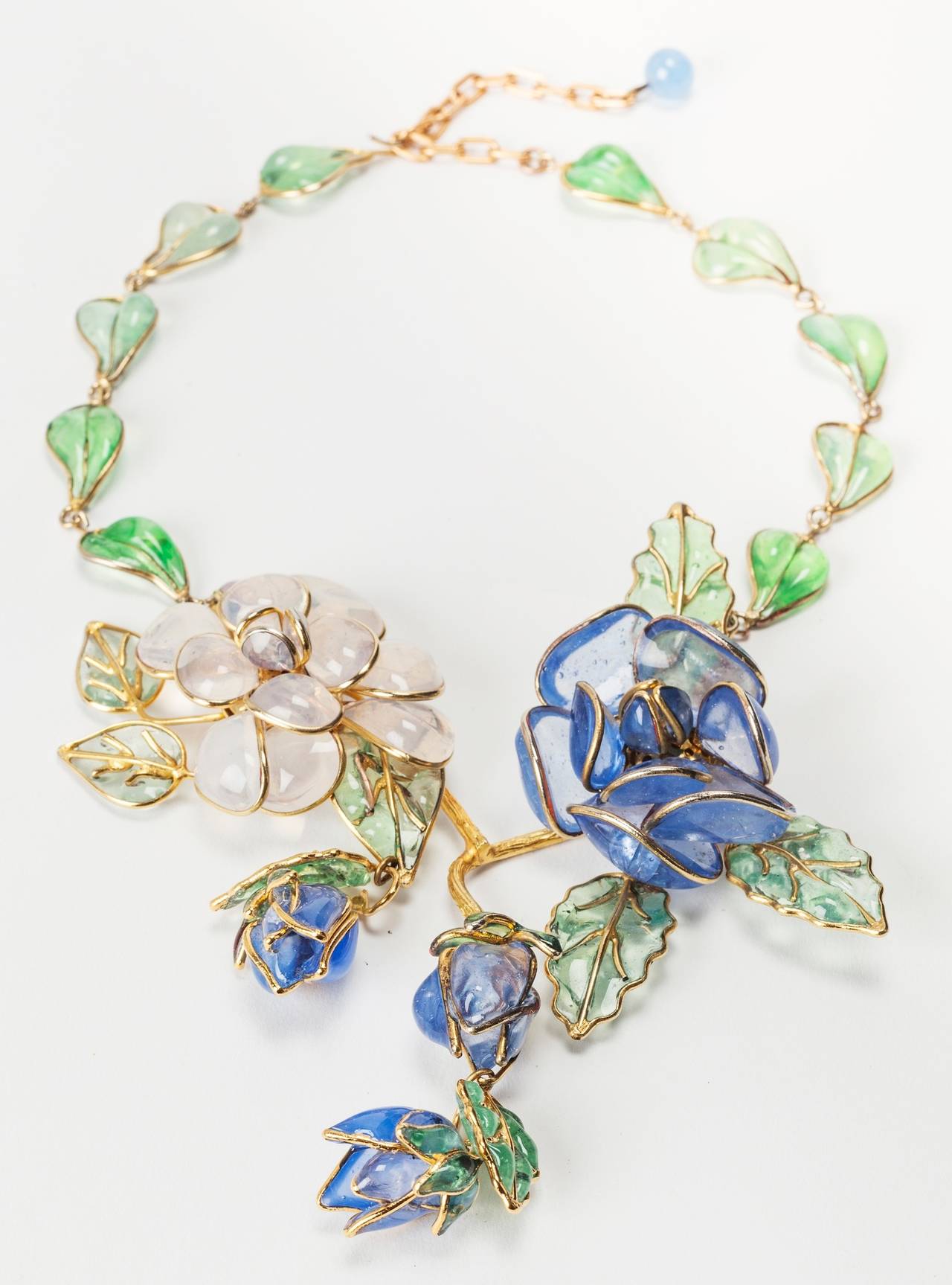 Magnificent Chanel poured glass enamel flower necklace. Made by Maison Gripoix of opaline and opal blue glass camellias and camellia buds . Further embellished with pale emerald poured glass leaves. Unsigned Haute Couture. 1950's France. Excellent
