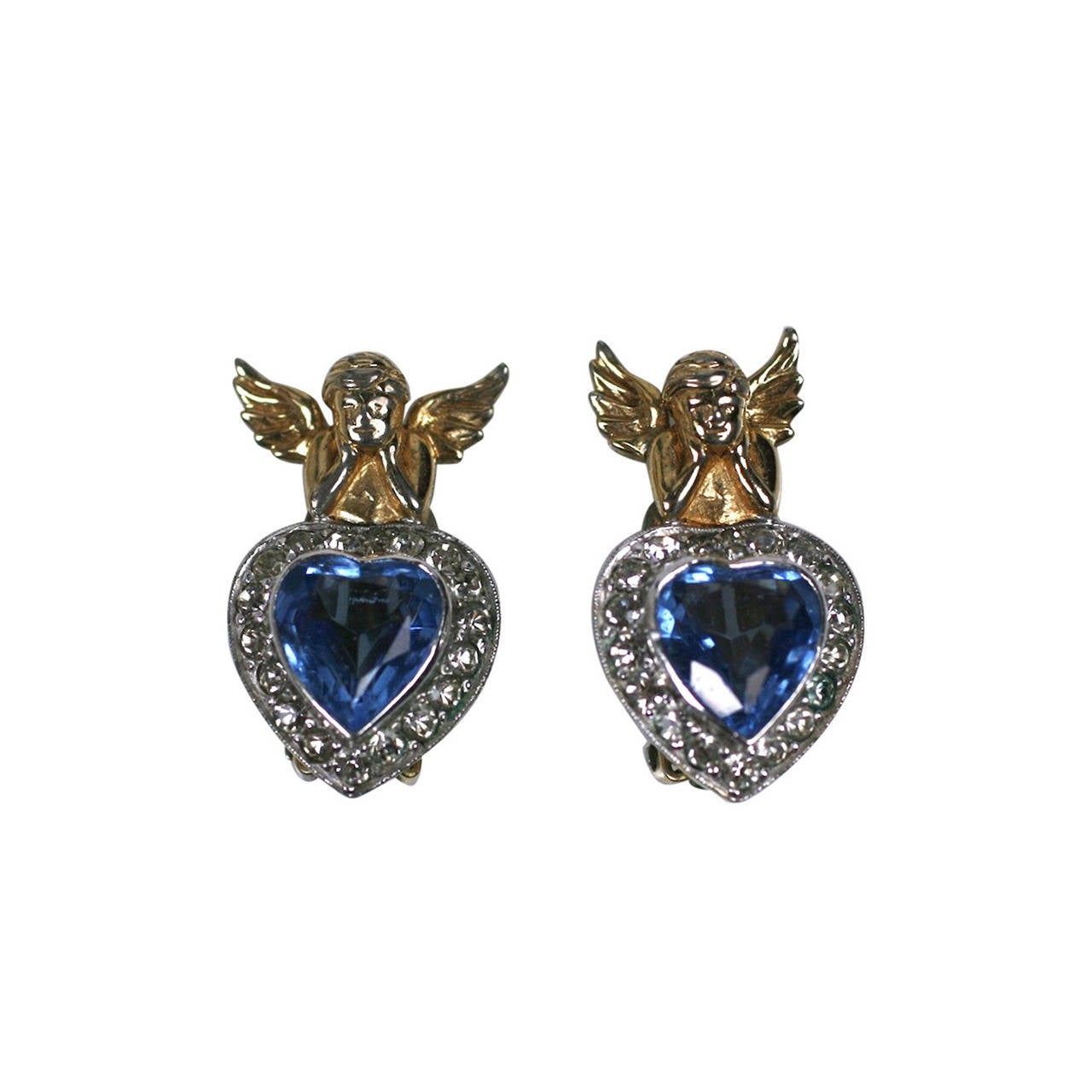 Boucles d'oreilles chérubin de Jomaz, style Verdura.