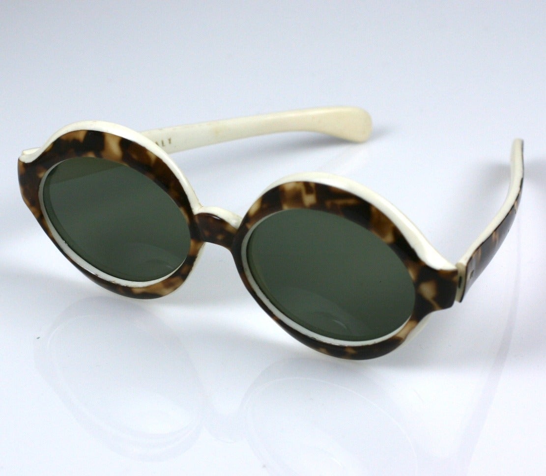 Italian sunglasses of faux Tortoise edged and lined in white plastic. Glamour from the 1950's.  5.5