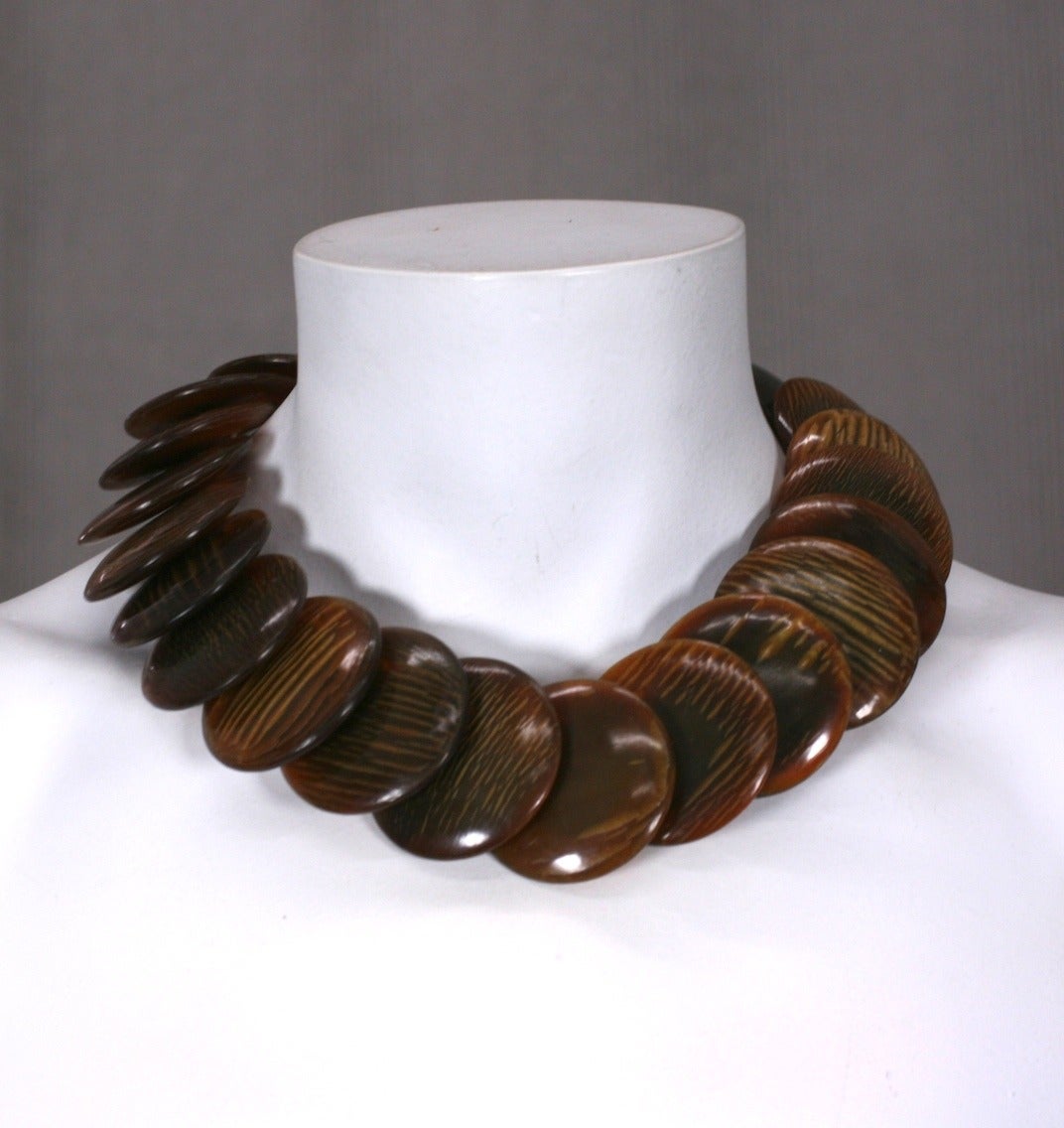 Monies faux Tortoise Disc Necklace by Gerda Lynggaard. Discs are bakelite or resin treated to have striations like an organic material. Very striking. 
15.5