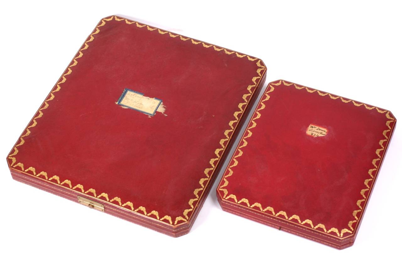 Pair of gorgeous Cartier Leather presentation Boxes which originally held Sterling picture frames. Today they can be used for display or presentation. 
Made in their signature crosshatched leather with gold embossed garlands around the edges. There
