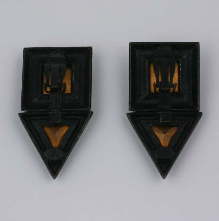 K.J.L.'s large geometric earrings set with a huge square and triangular 