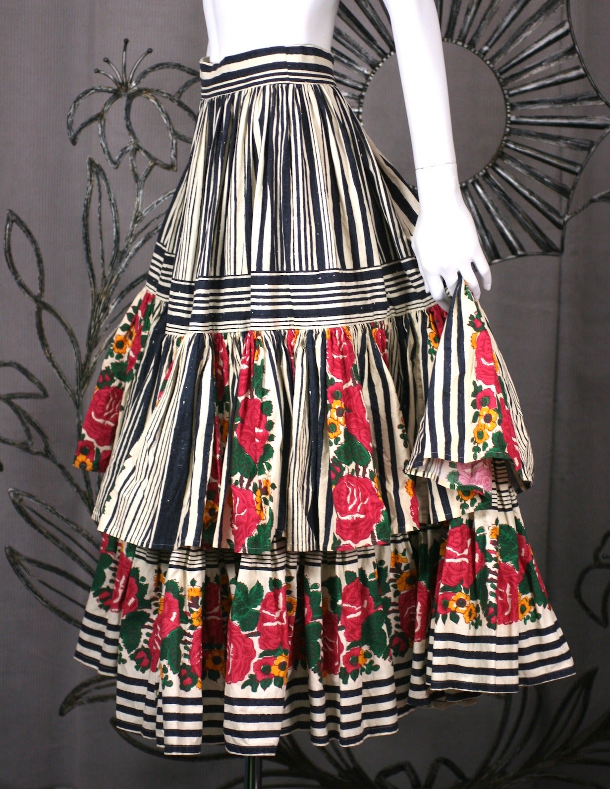 Super full, ruffled cotton skirt with antique Provencal wallpaper print. Skirt is gathered into waistband with 2 large ruffled tiers forming a dramatic Frida Kahlo like presence.
Excellent condition. 1980's France. 
Waist 25