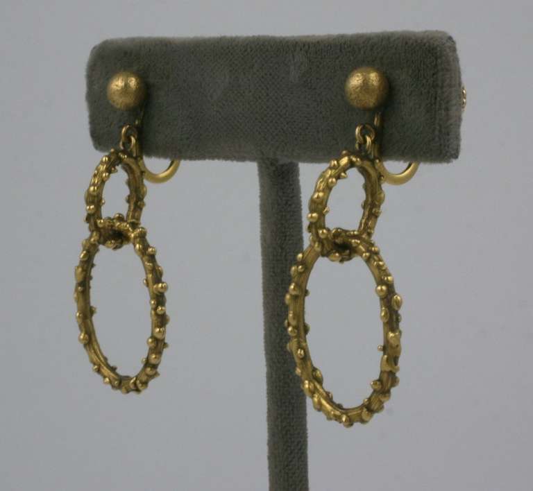 Brutalist 14K Gold Drop Hoops with screw back fittings. Textured balls are hand applied onto oval hoops which hand from textured ball tops. 1970's USA. 
Excellent condition.  1.5
