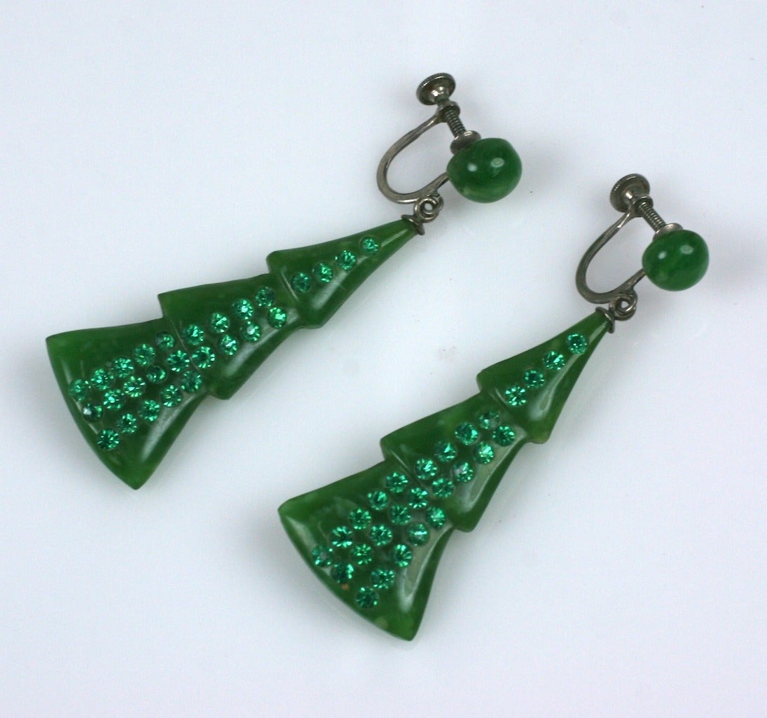 Deco green celluloid pave set earrings from the 1920's. The angular forms are set with faux emerald pastes. Screw back fittings. Excellent condition. 2