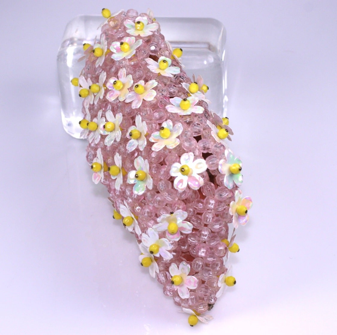 Charming Italian Hand Beaded Floral Clutch with iridescent floral paillettes on a pink crystal woven beaded base. 3 dimensional embroidery with pink faille lining. 7.5