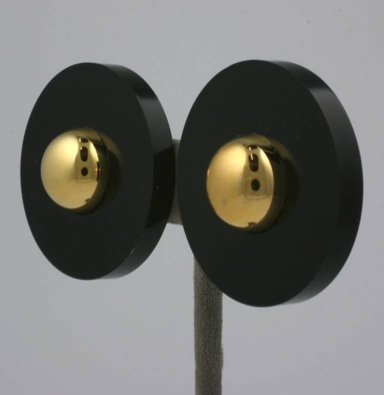 Striking modernist black acrylic disc earrings with high dome gilt center. Italy 1990's with clip back fittings. 1.5