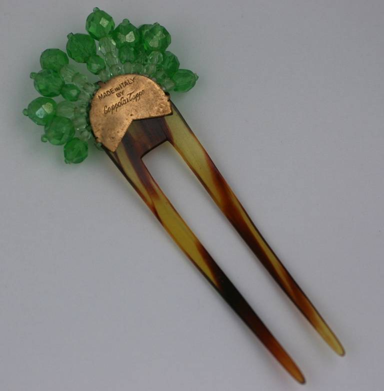 Coppola e Toppo
 Signed Coppola e Toppo comb in varied shades of green crystal set on double pronged faux tortoise hair comb.
Another identical comb is available in amythest. 

L4.50