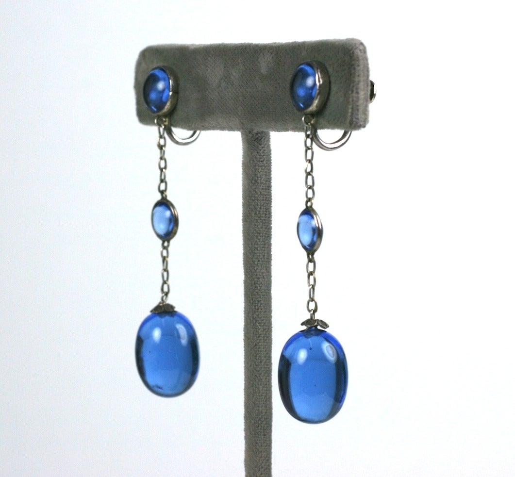 Delicate Art Deco Chinese blue glass earrings set in silver from the 1920's. Screw back fittings with bezel set drops and filigree floral caps. Excellent condition. 2.25