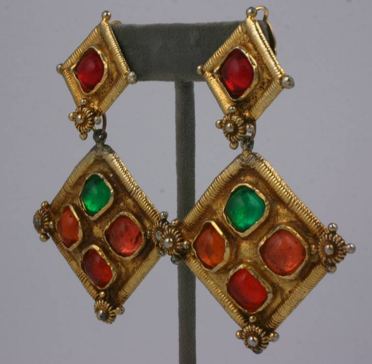 Large scaled Moroccan style pendant earrings by Christian LaCroix, Set with pate de verre cabochons in gilt metal with clip back fittings. Paris 1990's. 
Excellent condition. 3.25