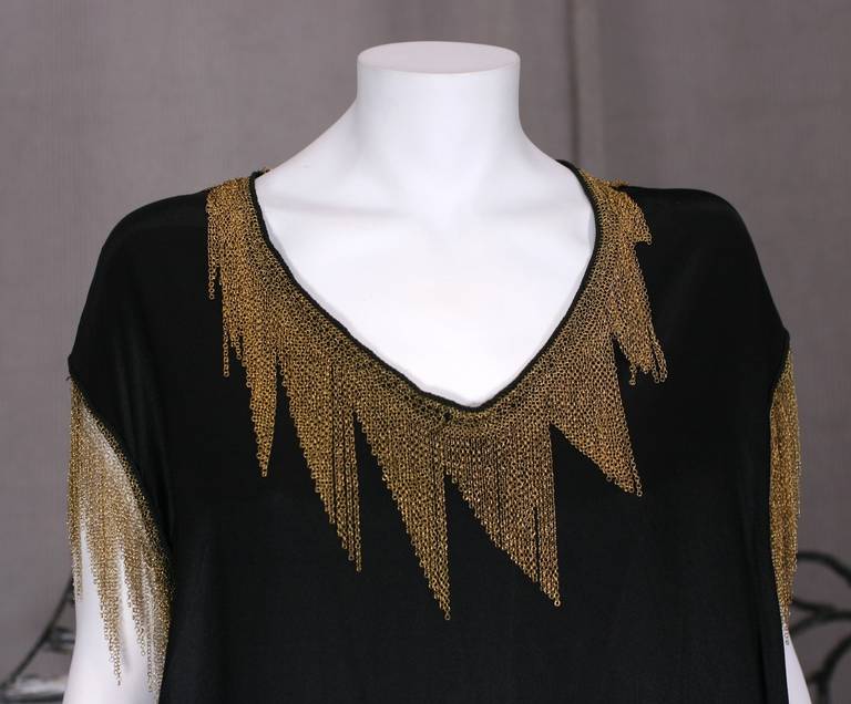 Art Deco Mesh Trimmed Blouse in black silk crepe. Hand trimmed fine gilt chain in a Deco zig zag pattern edging every edge, neckline, hem and arm hole. Essentially a black squared T shirt top with wonderful detailing. Extremely modern and timeless.