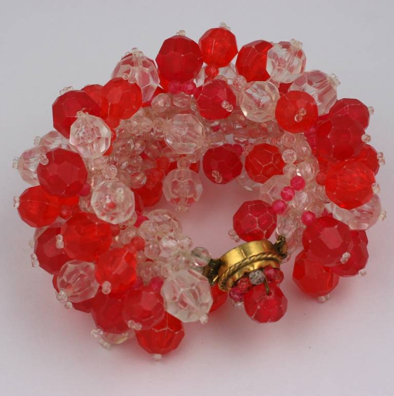 Coppola e Toppo wide woven Pop hued bracelet for Emilio Pucci, of bright red and crystal lucite crystals. Small wrist size.

The Coppola e Toppo company was formed in the late 1940′s by brother and sister designer duo, Bruno Coppola and Lyda Toppo