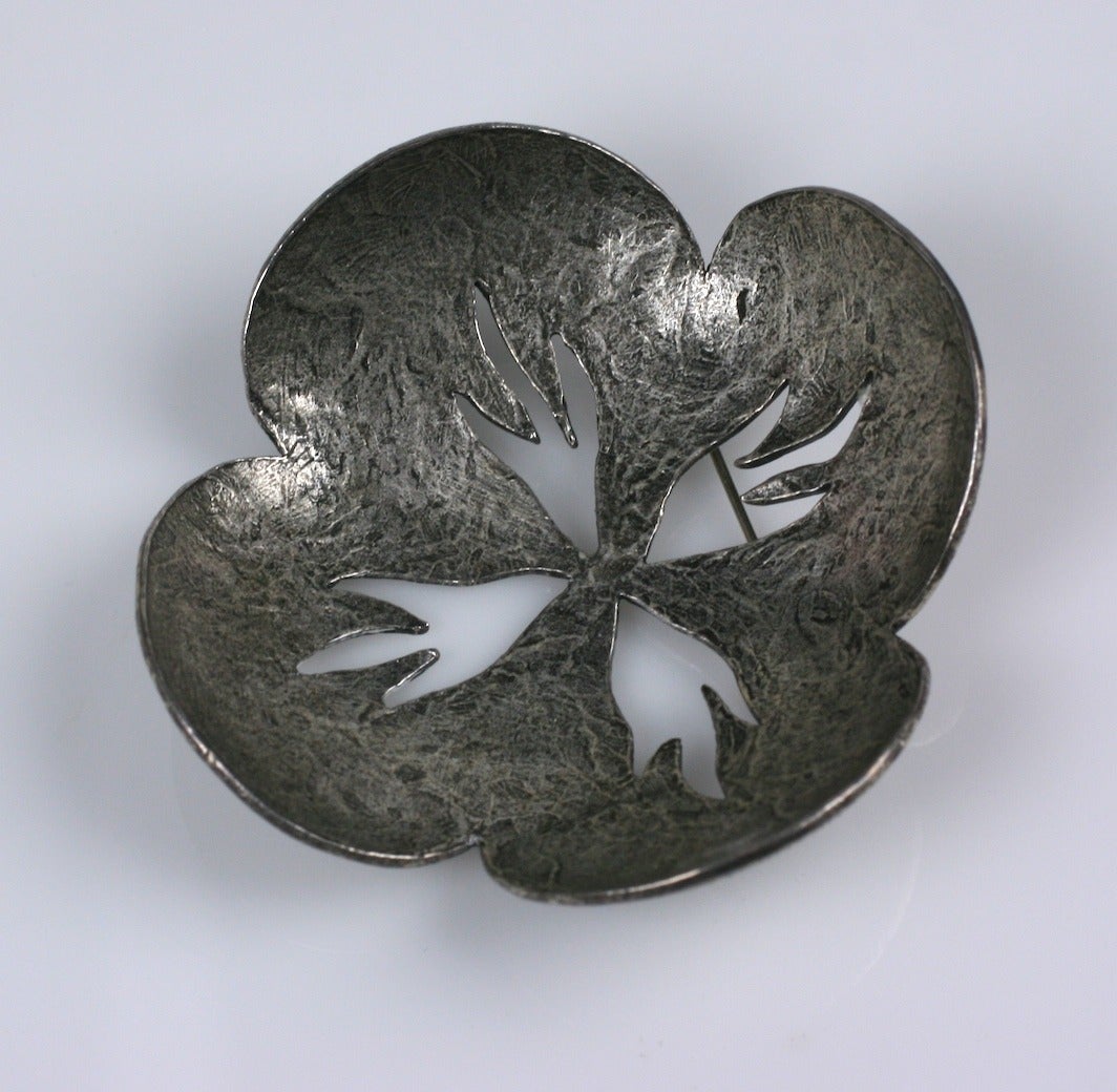 Delphine Nardin's organic, Japanesque cherry blossom  brooch of antiqued silver plated metal with positive-negative cutouts.
artist signed ,Made in France. Excellent condition. 1980's France.

2.75