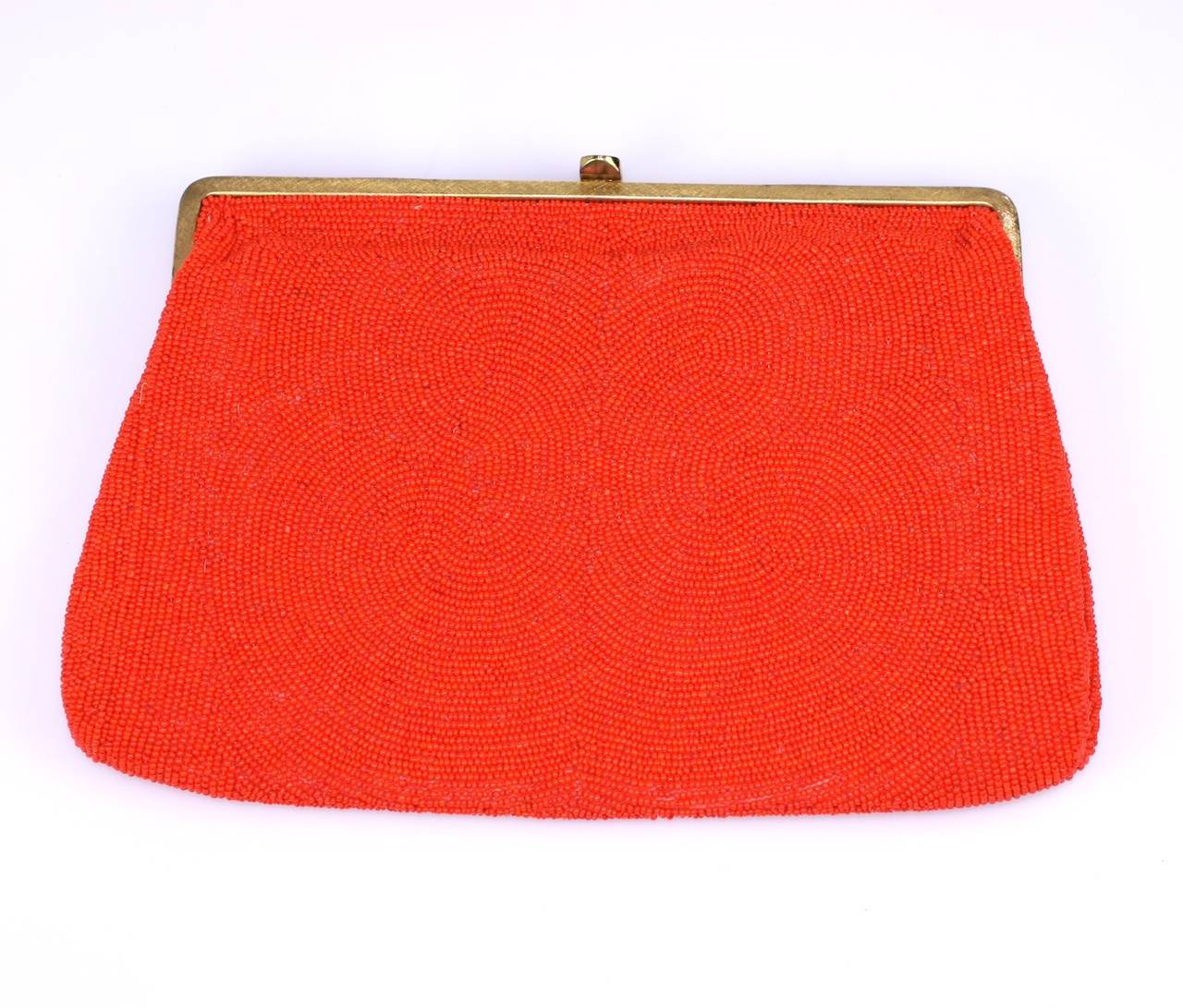 Vivid orange caviar beaded bag, Walborg, Belgium. Can be used as clutch or can also be used with retractable handle as well. Perfect when a burst of color is called for.
9