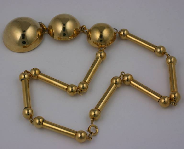 Large pendant necklace of gilt metal from the 1960's. Formed of gilt tubes and half domes which graduate to largest on bottom. 1960's USA.
Drop 4.75