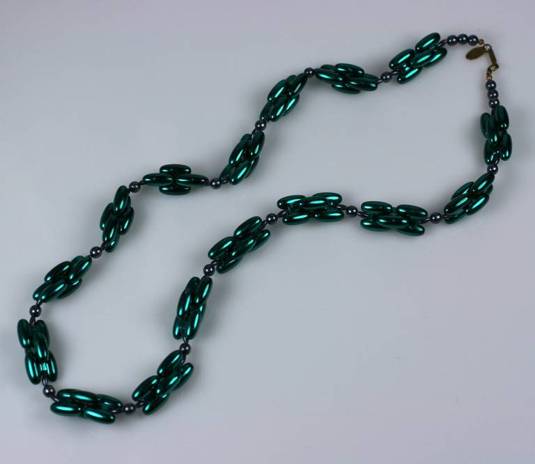 Miriam Haskell's necklace of green metallic finish which is fused onto light weight resin links. Great pop of color with a finish like metallic car paint.
1980's USA. 28