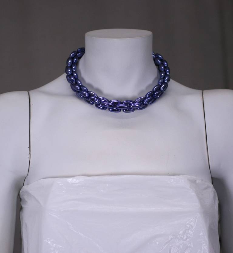 Miriam Haskell's necklace of purple metallic finish which is fused onto light weight resin links. Great pop of color with a finish like metallic car paint.
16