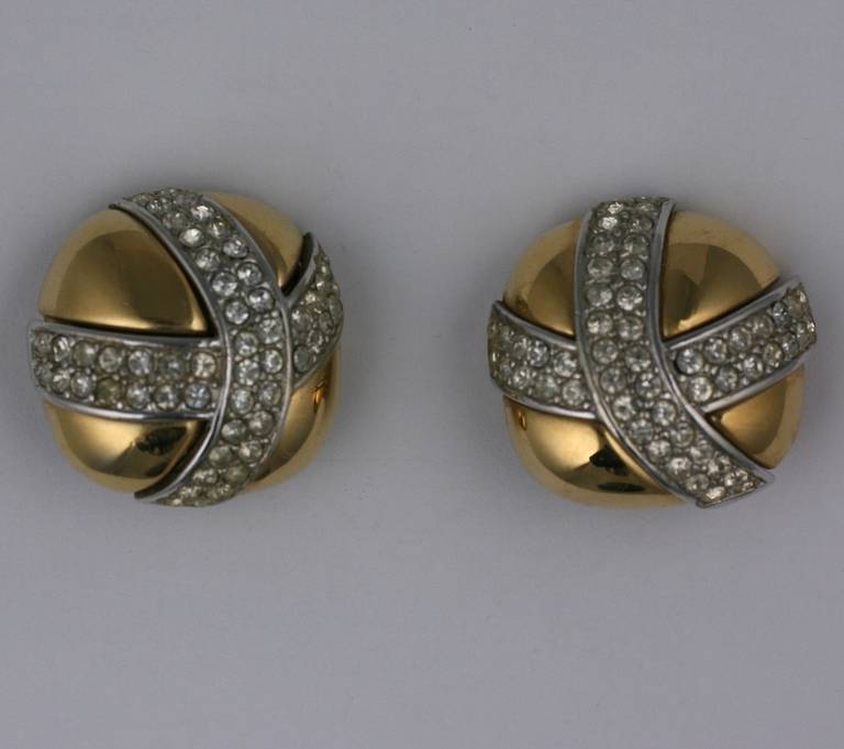 Attractive Givenchy large scaled clip earrings in gilt metal with large contrasting pave 