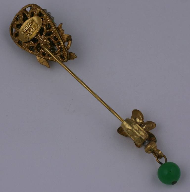 Miriam Haskell's Russian gold plate stickpin brooch of faux jade pate de verre,  rose montes crystals, and finely sewn seed pearls. Excellent condition. 1940's USA. Length 3