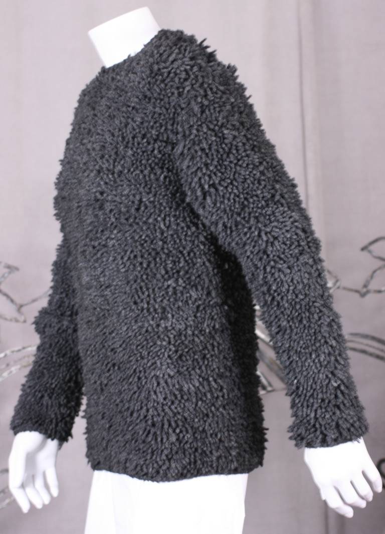 Cool charcoal shag rug inspired Italian sweater from the 1960's. Fashion and home decor combine in this cool textural hybrid top...as dimensional and lush as images appear. Pulls over with button closure at back of neck. Wear with slim pencil pants