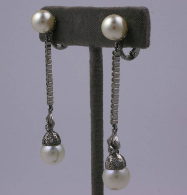 Art Deco sterling silver paste and faux pearl long drop earrings. Clip back fittings set in 835 grade silver. 1920's European.
L 2.25
