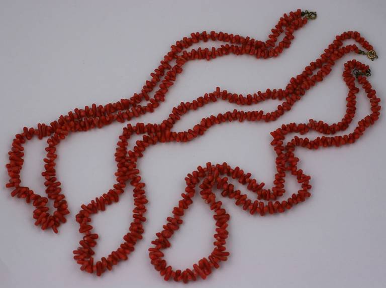 3 antique necklaces of tumbled coral toggles. Not raw branch coral, as these are all matched and cut to a similar shape, form and color. Great alone or twisted together. Each strand 22