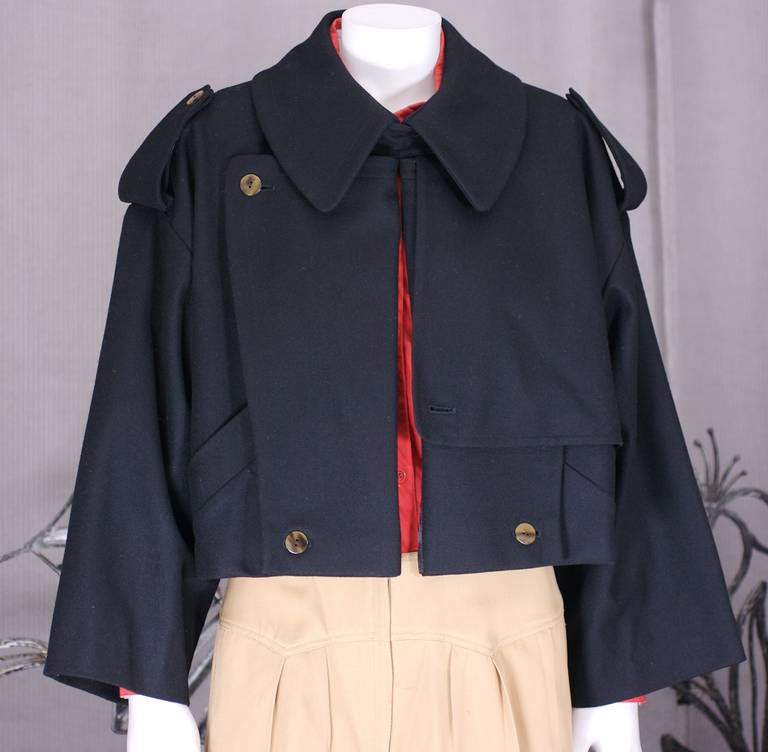 Early iteration the JPG trench made when he was designing for Bogy's Italy. A classic navy wool flannel trench is judiciously chopped at the waist while the shoulders are pulled downwards and the slash pockets are pulled up. The overall cut is loose