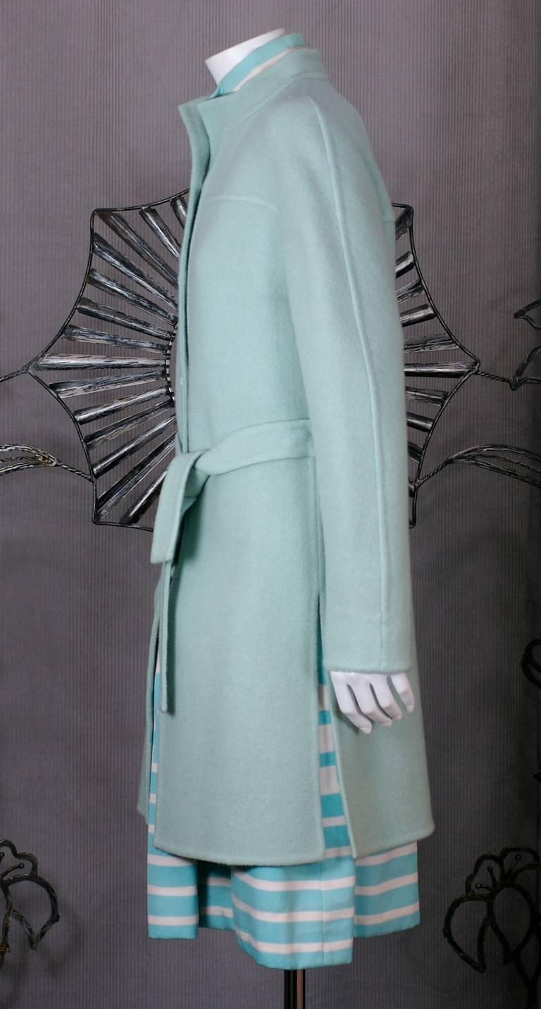 Jean Patou by Karl Lagerfeld afternoon ensemble, comprising a pale aqua  double faced wool coat and an ivory and aqua linen dot and stripe sleeveless dress with fun floppy patch pockets. Coat is slashed at sides and back.
Great together or as