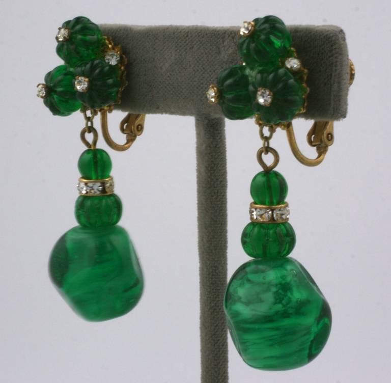 Drop earrings by Miriam Haskell of fluted and tumbled emerald pate de verre beads accented with rhinestone pastes. Clip back fittings. 1950's USA. Excellent condition. 2.2