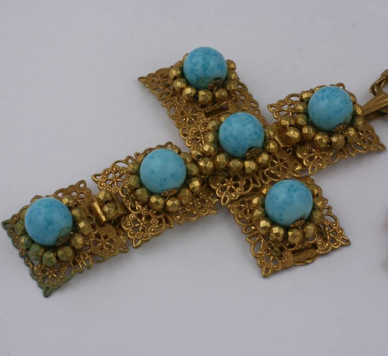 Miriam Haskell's Turquoise pate de verre cross  pendant necklace. Embellished with gilt  facated cut steel bead work on signature Russian gold finished filigrees. 1950's USA.
Cross 3.25