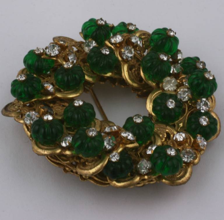 Miriam Haskell dimensional layered brooch of gilt filigrees, pastes and fluted emerald pate de verre beads. Elegant and timeless. Signature Russian gold finish. 1950's USA. Excellent condition.  2.25