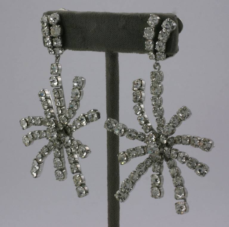 Elegant pendant earrings of hand set rhinestone crystal stars suspended from pave clip fittings. Handmade settings. 1950's West Germany. 
3