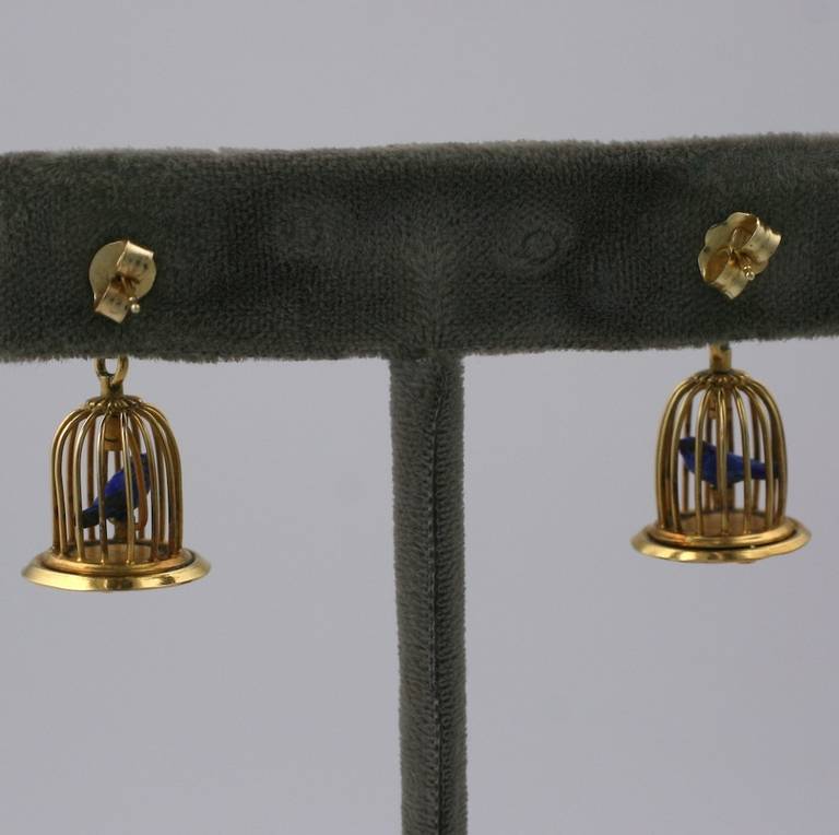 Charming bird cage earrings of 14k gold with cultured pearls. Little caged songbirds are enameled blue on sterling. 
The bird cage and mounts are set in 14K gold. Post fittings. 
7 mm cultured pearl at ear. 1
