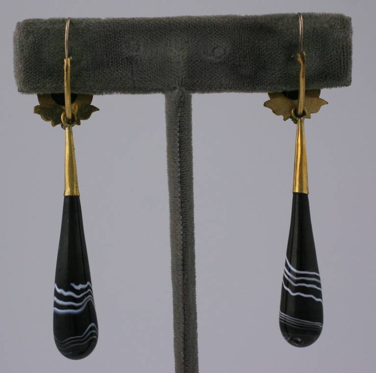 19th century, gilt and hand made faux banded agate glass long drop earrings with pierced lever backs. These are unusual period copies of gem banded agate earrings usually set in gold. Earrings close from back to front. 2.25