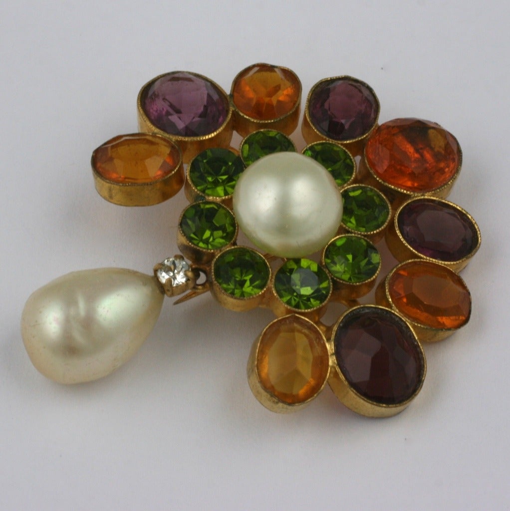 Early Chanel Medieval Pendant Brooch by Goossens in signature colors. Stones are set right side up and upside down as is often in jeweled Chanel pieces. Faux citrine, amythest and peridot pastes surround hand made glass pearl cabochon with