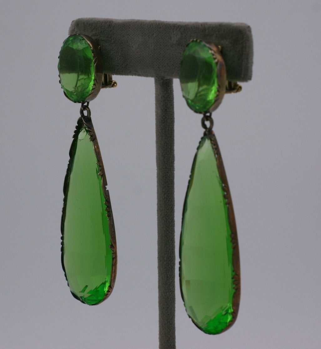 Amazing Georgian paste earrings in the most extraordinary shade of lime green from the early 19th Century. Set in a scalloped 14k gold setting around each stone. 
Georgian earrings of this quality, scale and color are so incredibly rare. The