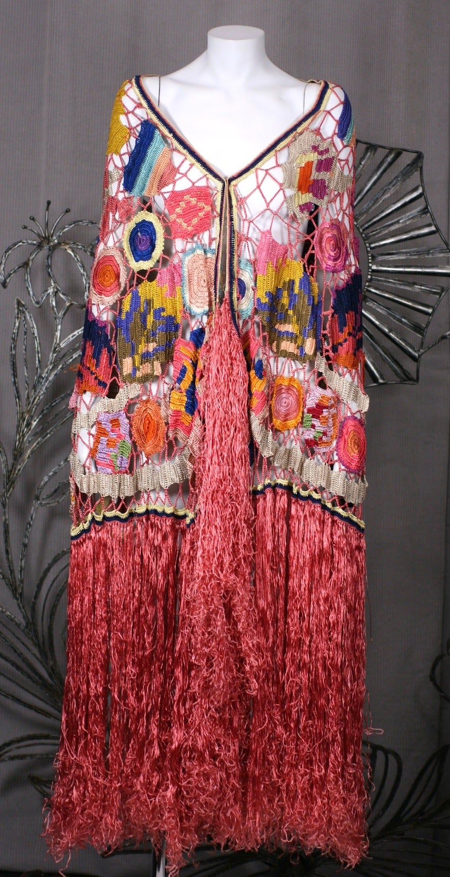 Amazing Austrian Secessionist Hand Crochet Shawl in the most extraordinarily vibrant tones of rayon yarn. Figural motifs such as abstracted flowers, leaves and birds (parrots) are found all over this hand made shawl from the period of the Weiner