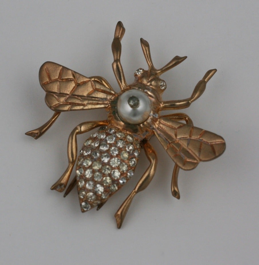Nettie Rosenstein Wasp brooch of pink gold washed sterling silver with faux pearl and crystal pave. Fur clip fittings. 1940's USA. 2