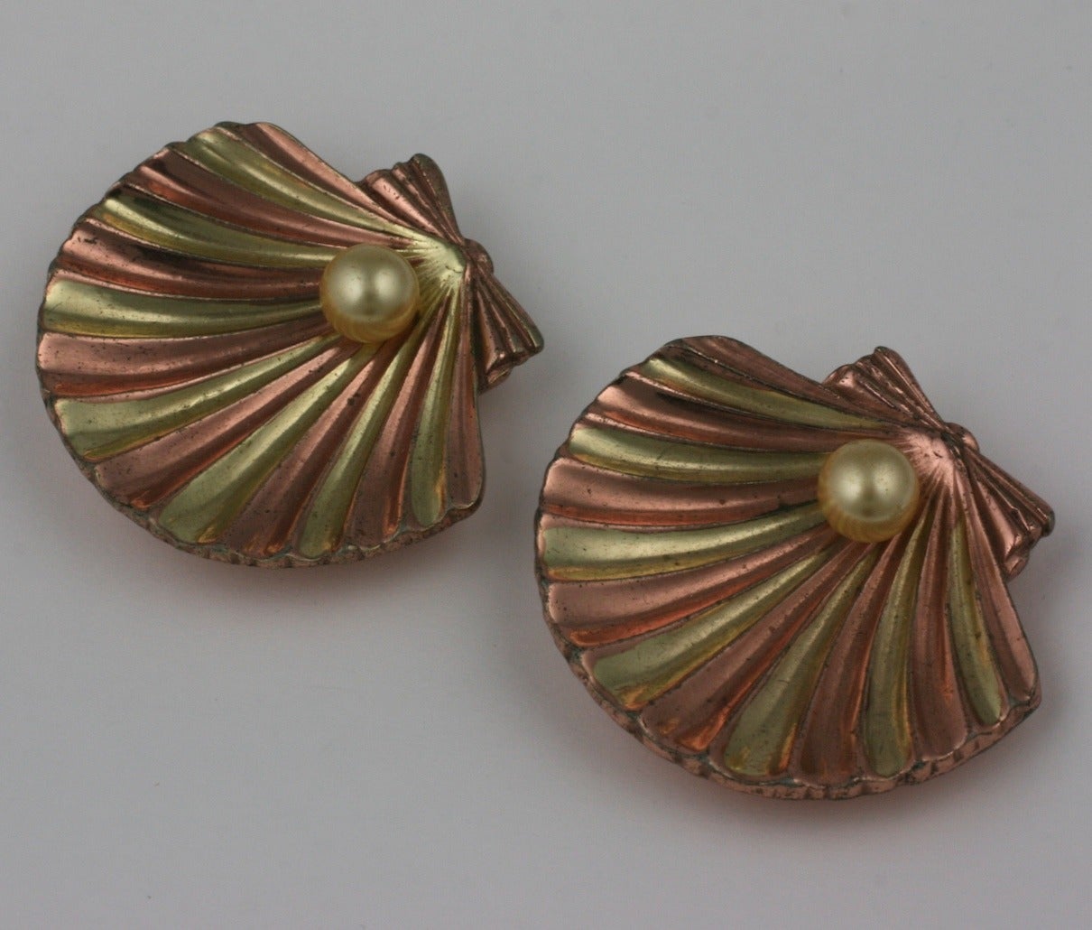 Elegant Trifari retro two tone pink and yellow gold striped scallop fur clip brooches with faux pearls. 1.5