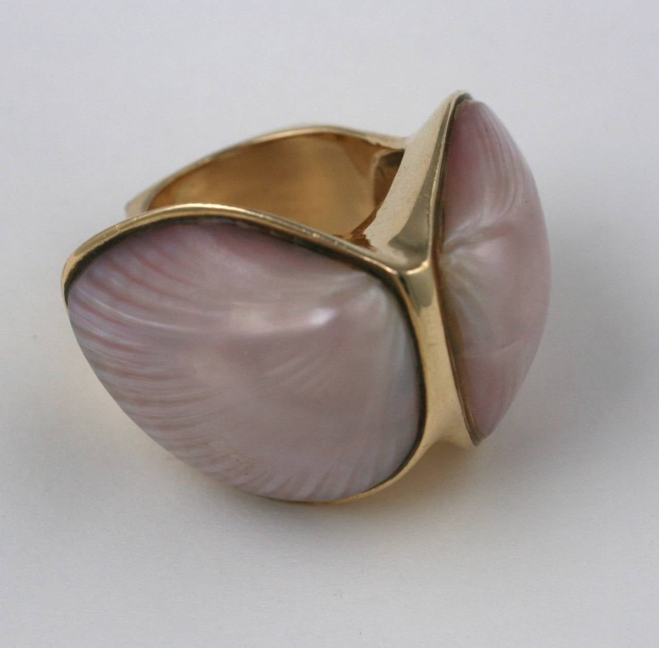 Elegant and formidable oversized ring by Marguerite Stix circa 1965, named The Margaretacea, one of her most recognized and popular designs.
Exotic clam shells with a pinky lilac iridescence are the "stones" used for this ring. An