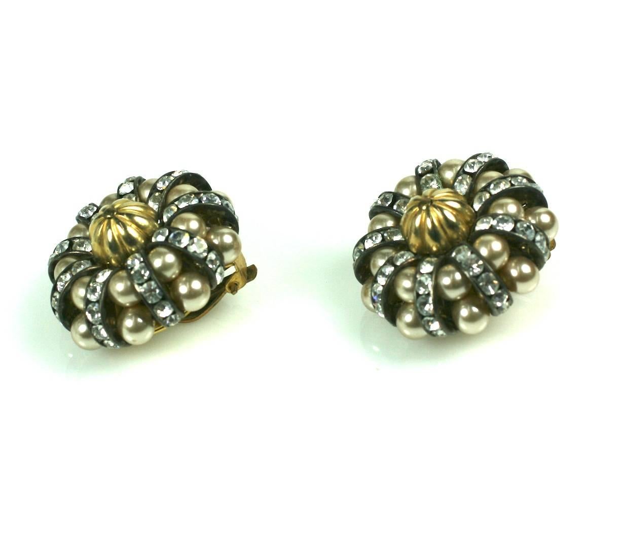 Attractive French Pearl and Pave Rondel Cluster Earrings from the 1950's. Layers of beige faux pearls alternate with pave rondels in silvered settings against a central fluted gold metal cabochon. Clip back fittings. 1950's France. Excellent