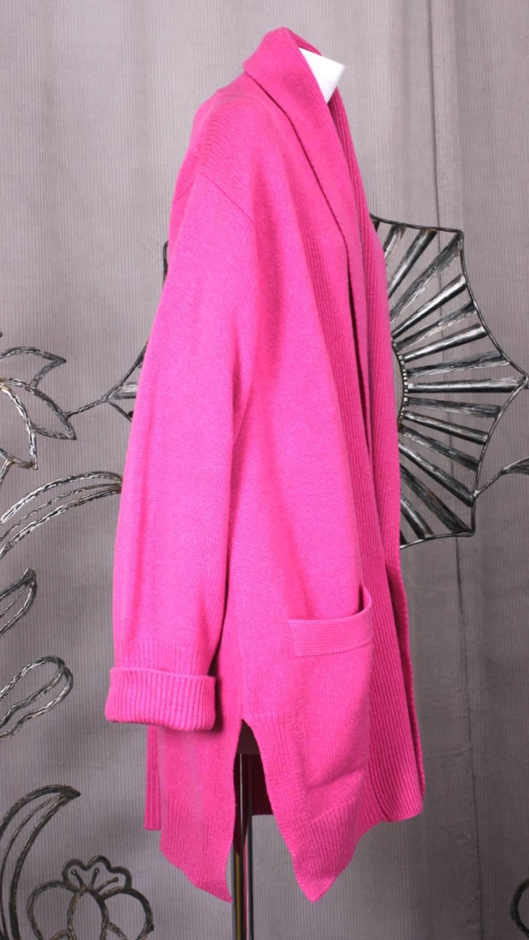 Luxurious Scottish Cashmere Oversized Cardigan by Hawick, Scotland in rasberry pink. XL large size allows for wrapping and belting with slashed side seams. Ribbed trim forms shawl collar. Excellent condition. 