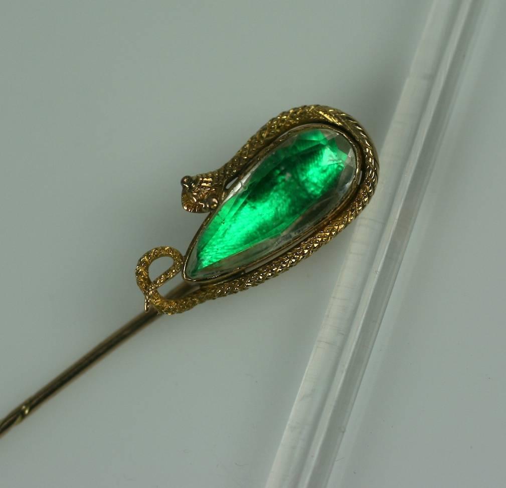 Highly unusual handmade Victorian snake stickpin in 14K gold with lovely detailing. A fully formed snake is wrapped around a pear shaped faceted rock crystal. Hidden beneath in the setting is a genuine beetle wing, which reflects its nile green,
