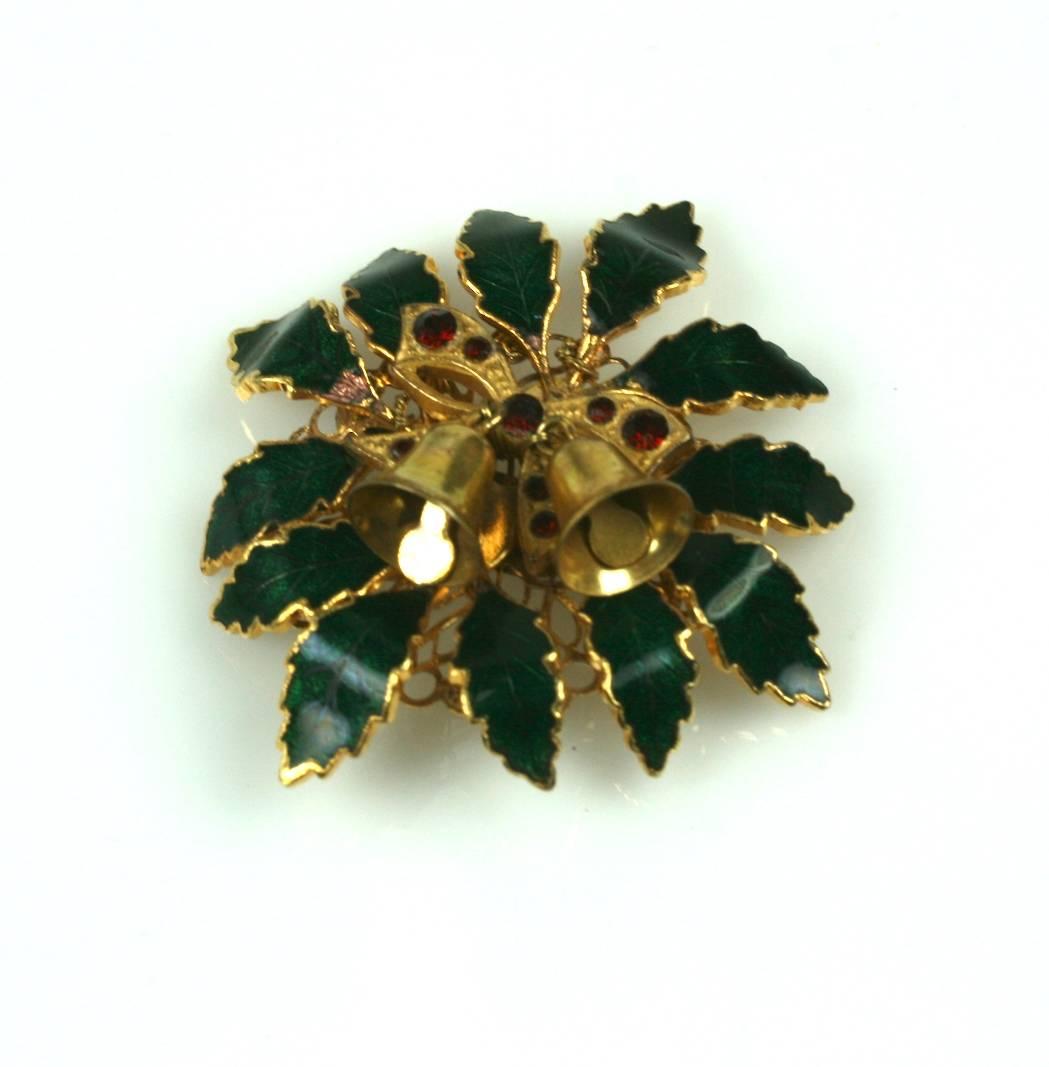 Miriam Haskell Holiday Holly Brooch of signature Russian gilt with filigree bow set with ruby crystals and Russian Gilt Christmas Bells, and hard enameled  holly green leaves . Excellent condition.