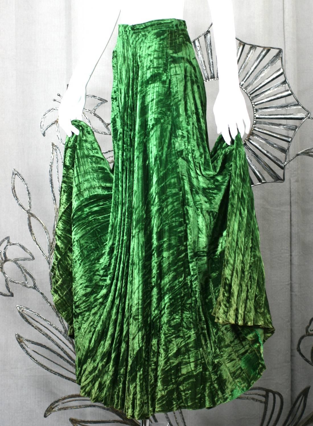 Early Yves Saint Laurent Rive Gauche bohemian style long pleated skirt in bottle green rayon crushed panne velvet. Full circle cut. 1970's France. 
Very Good Condition, faint fading to bottom hem throughout.
Waist 25