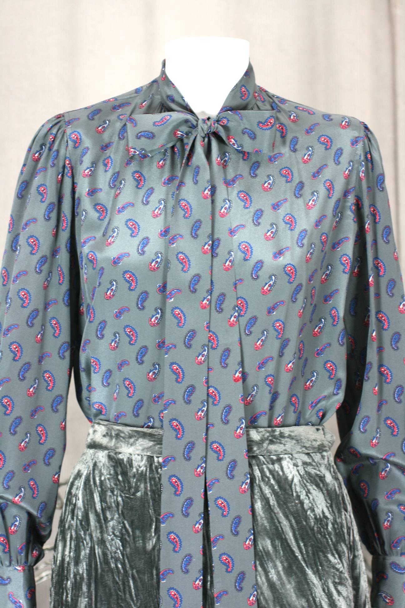 Yves Saint Laurent silk crepe blouse in deep gray with paisley print and super long neck tie.
Vintage size 34. Length 23