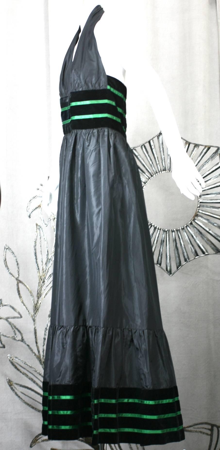 Lanvin Haute Couture Silk Taffeta Halter. Simple and flattering halter neckline is held by a wide band of black silk velvet trimmed with bright green satin ribbon. The motif is repeated along the hem as well.  
Full gathered skirt falls from waist